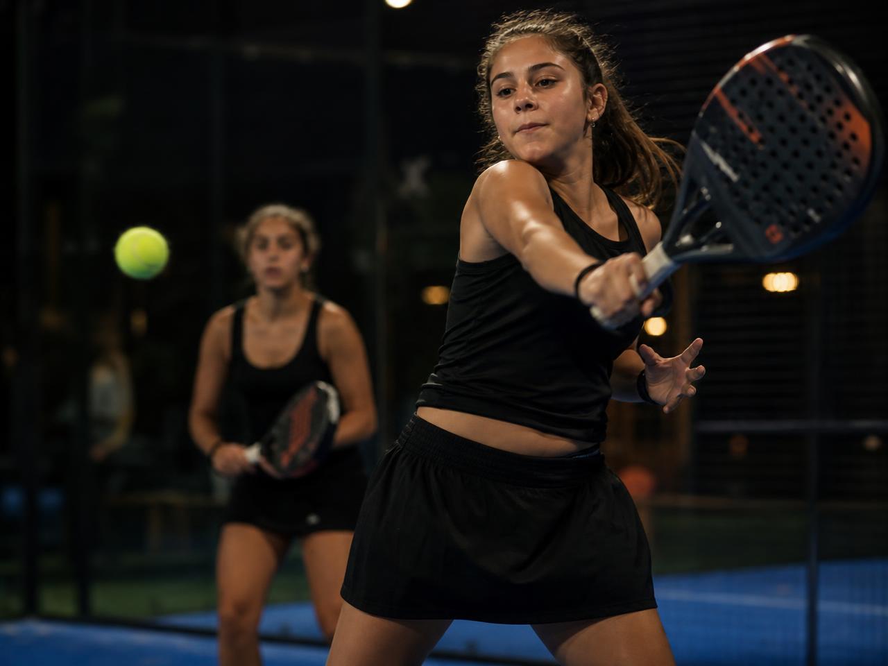 Girls Under 18 division — SA Grand Tour players in competitive match play on a championship padel court